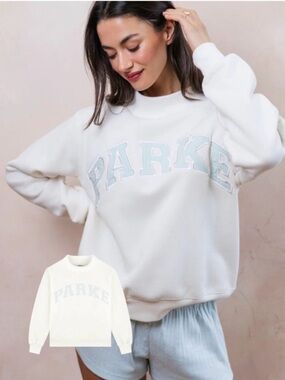 Parke White varsity mock neck with Light Blue Logo